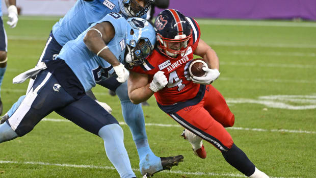 Nov 11, 2023; Toronto, Ontario, CAN; Montreal Alouettes fullback James Tuck (40) is stopped by Toronto Argonauts defensive back Adarius Pickett (6) in the second half at BMO Field. Mandatory Credit: Dan Hamilton-USA TODAY Sports  